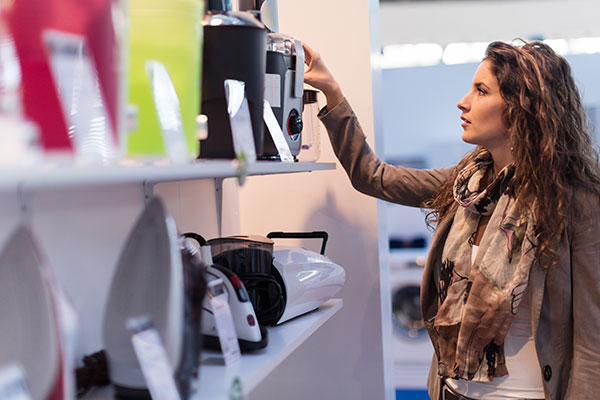 Shopper looks at electronic item