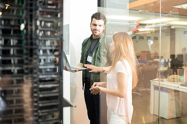 Workers in server room