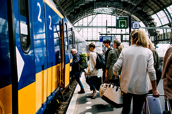 Passengers board a train