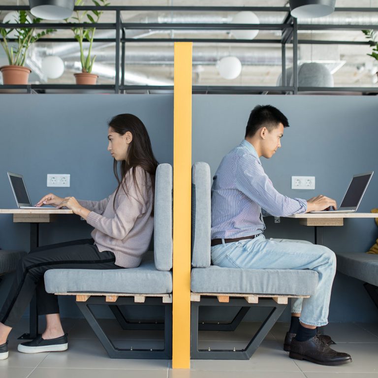 Workers in open plan office space