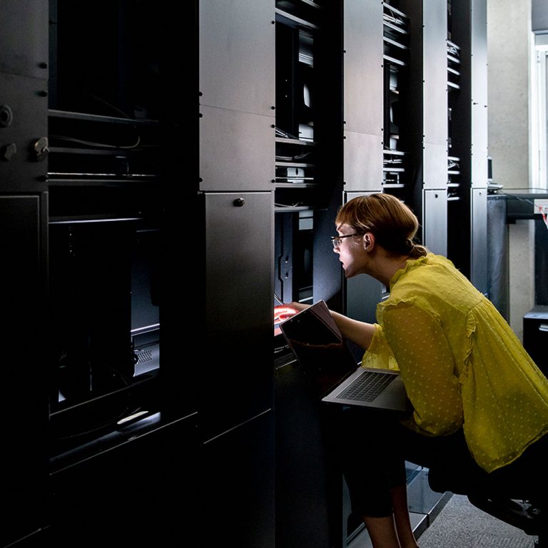 Woman working in server room