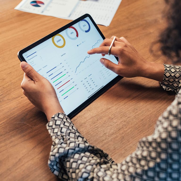 Woman on tablet looking at data