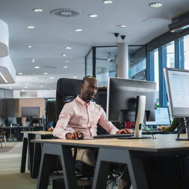 Worker on computer in office