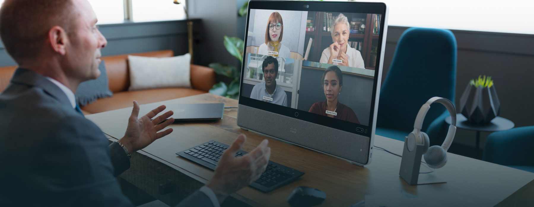 A man in an office on a Cisco WebEx team call